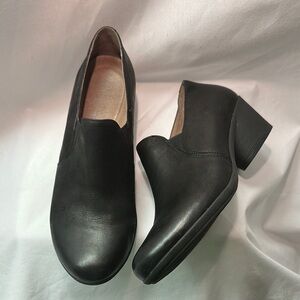 Dansko- Black slip on heeled loafer.